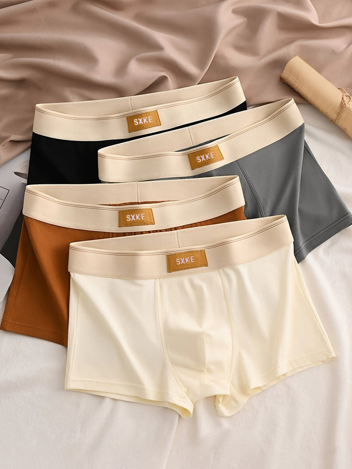 "4-pack heren boxershorts in ademend katoen, effen kleuren, comfortabele pasvorm voor dagelijks gebruik en sport."