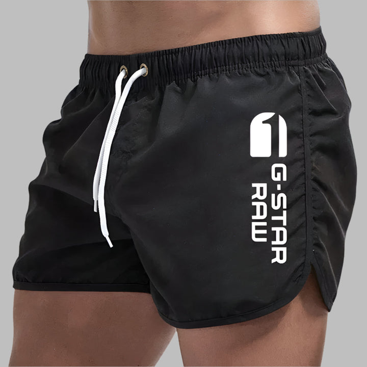 Sportieve meerkleurige heren zwemkleding, sneldrogend en comfortabel. Perfect voor actieve stranddagen.