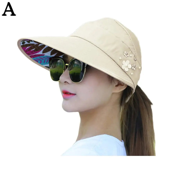 "Anti-UV dames strandhoed met brede rand, opvouwbaar polyester, beige kleur, biedt stijlvolle zonbescherming en comfort"