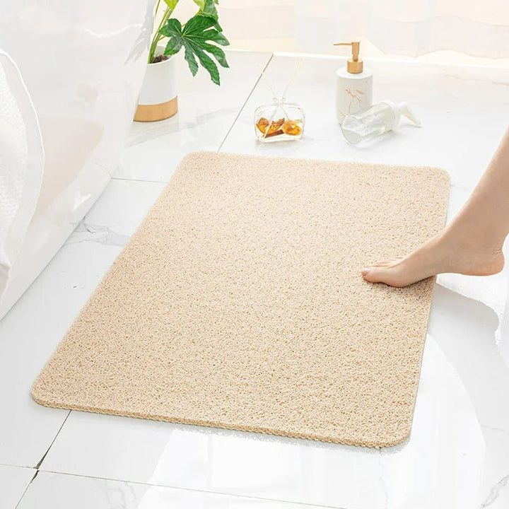 "Antislip douchemat in beige, bruin of grijs. PVC materiaal, 40x60 of 50x80 cm, veilig en comfortabel douchen."