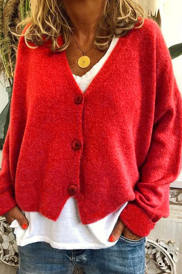 "Aspen vest in geel met elegant patchwork, V-hals en lange mouwen. Knus en trendy voor dames, ideaal voor elke gelegenheid."