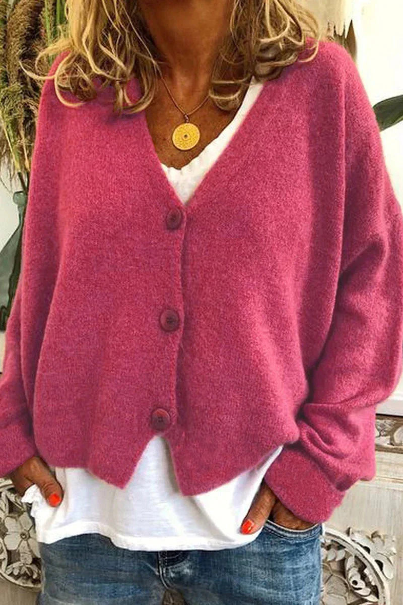 "Aspen vest in geel met elegant patchwork, V-hals en lange mouwen. Knus en trendy voor dames, ideaal voor elke gelegenheid."