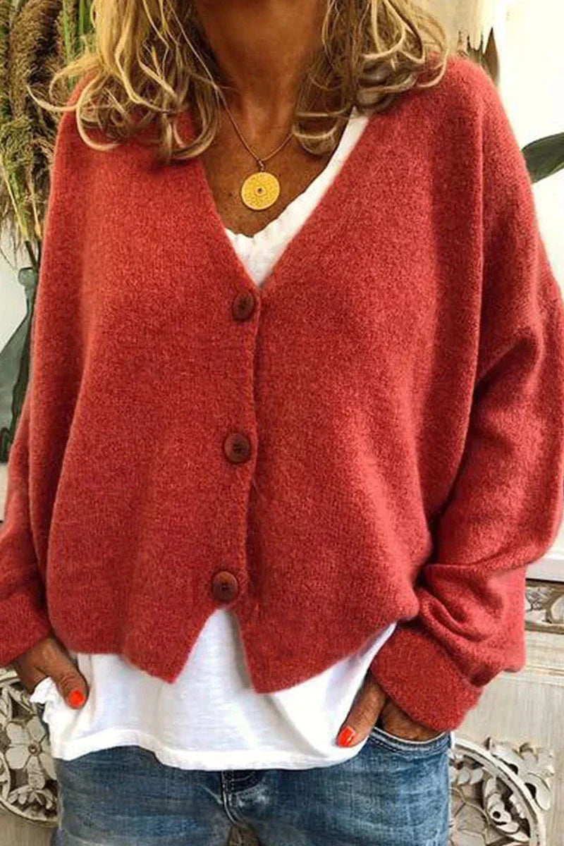 "Aspen vest in geel met elegant patchwork, V-hals en lange mouwen. Knus en trendy voor dames, ideaal voor elke gelegenheid."