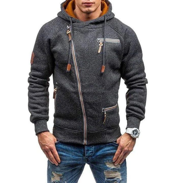 "Asymmetrische heren hoodie, stijlvol ontwerp met ritssluiting en voorzakken, perfect voor modieuze herfstdagen."