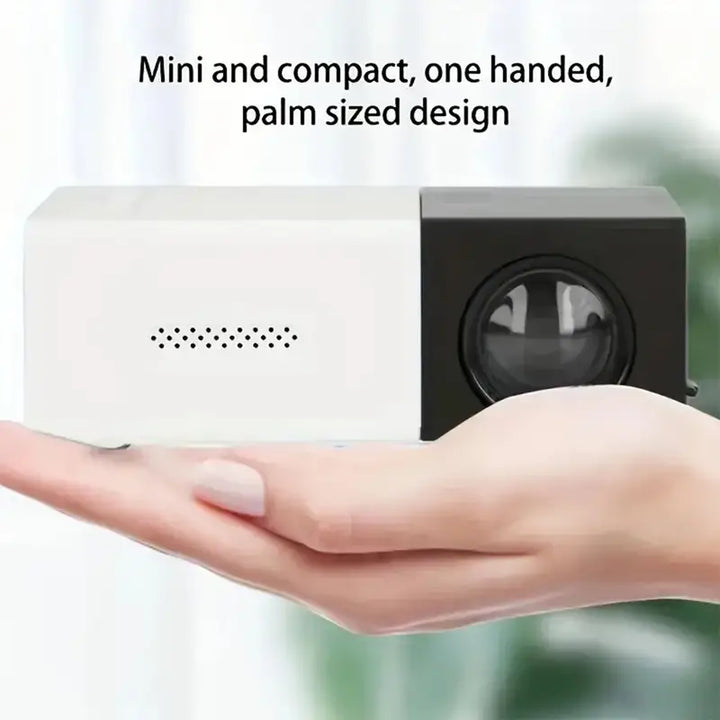 Bovenaanzicht van de Aurora LED miniprojector, toont lens en bedieningsknoppen, ideaal voor camping gadgets.