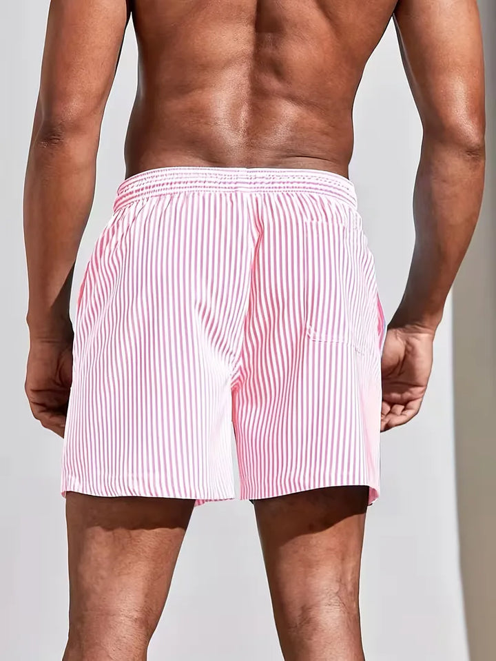Heren zwemshorts, gestreept in blauw en roze, met comfortabele pasvorm. Ideaal voor zomerse zwem- en stranddagen.