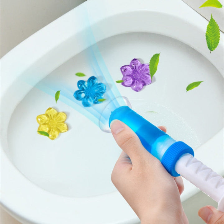 "Bloemige toiletreiniger in fles, geurverwijderend, helder wit met roze accenten, veilig voor septic tanks."