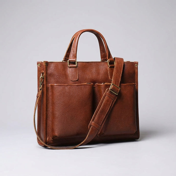 Ruime donkerbruine Leatheron documententas, perfect voor zakelijke professionals met laptop en accessoires.