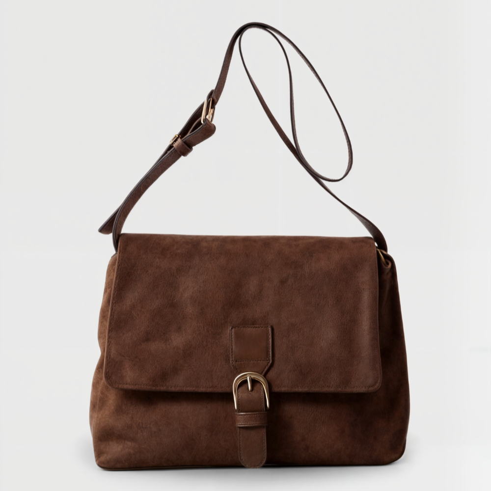 Bruine retro suède dames schoudertas met gesp, elegant en vintage, draagbaar als crossbody accessoire.