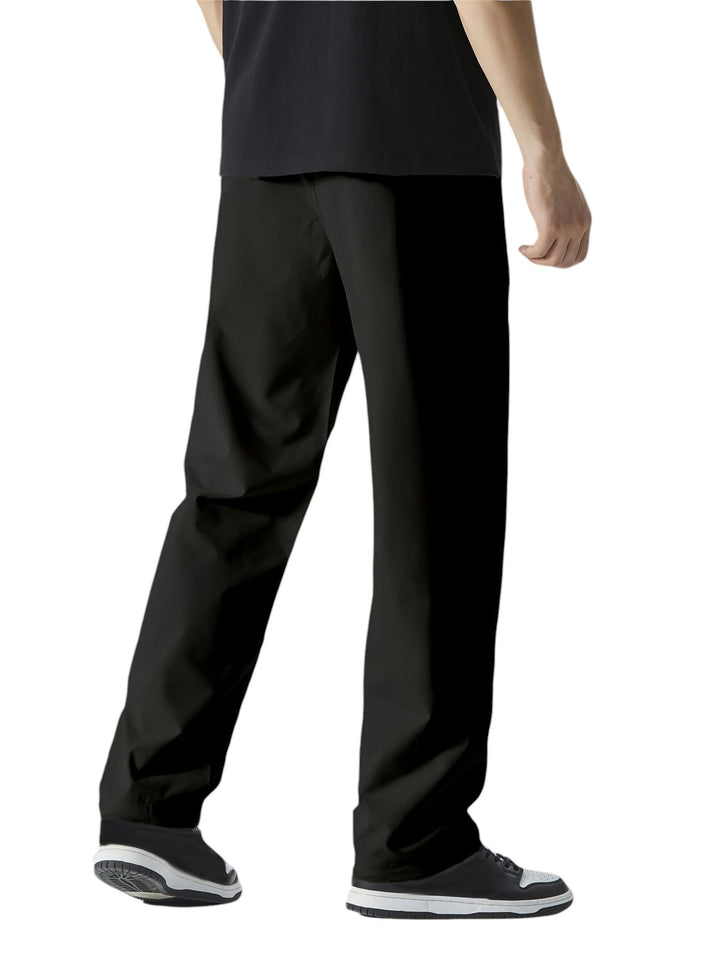 "Casual chique heren joggingbroek, donkergrijs, ademende stof, elastische tailleband met trekkoord, comfortabele pasvorm."