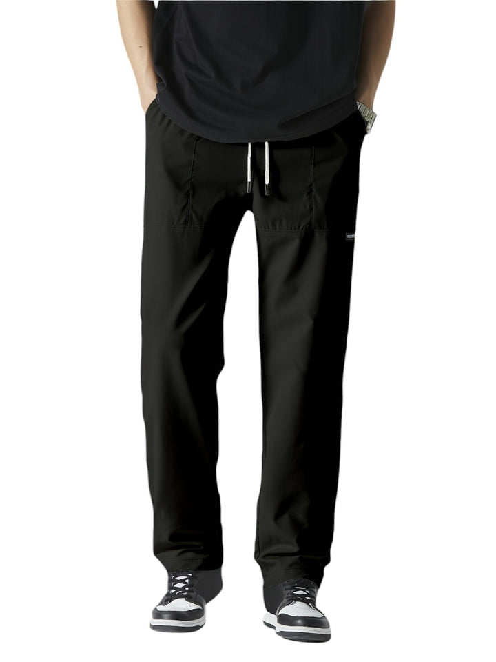 "Casual chique heren joggingbroek, donkergrijs, ademende stof, elastische tailleband met trekkoord, comfortabele pasvorm."
