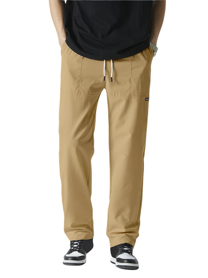 "Casual chique heren joggingbroek, donkergrijs, ademende stof, elastische tailleband met trekkoord, comfortabele pasvorm."