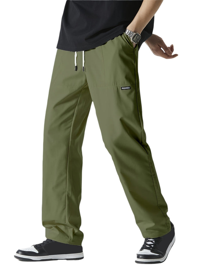 "Casual chique heren joggingbroek, donkergrijs, ademende stof, elastische tailleband met trekkoord, comfortabele pasvorm."