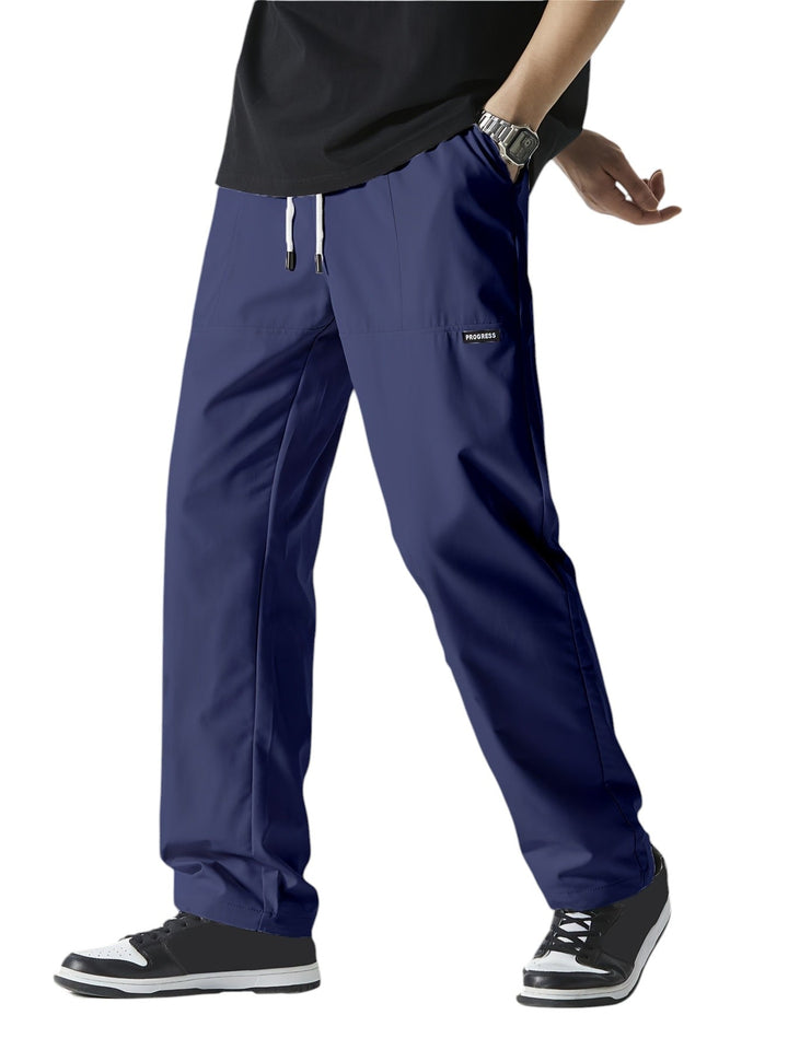 "Casual chique heren joggingbroek, donkergrijs, ademende stof, elastische tailleband met trekkoord, comfortabele pasvorm."