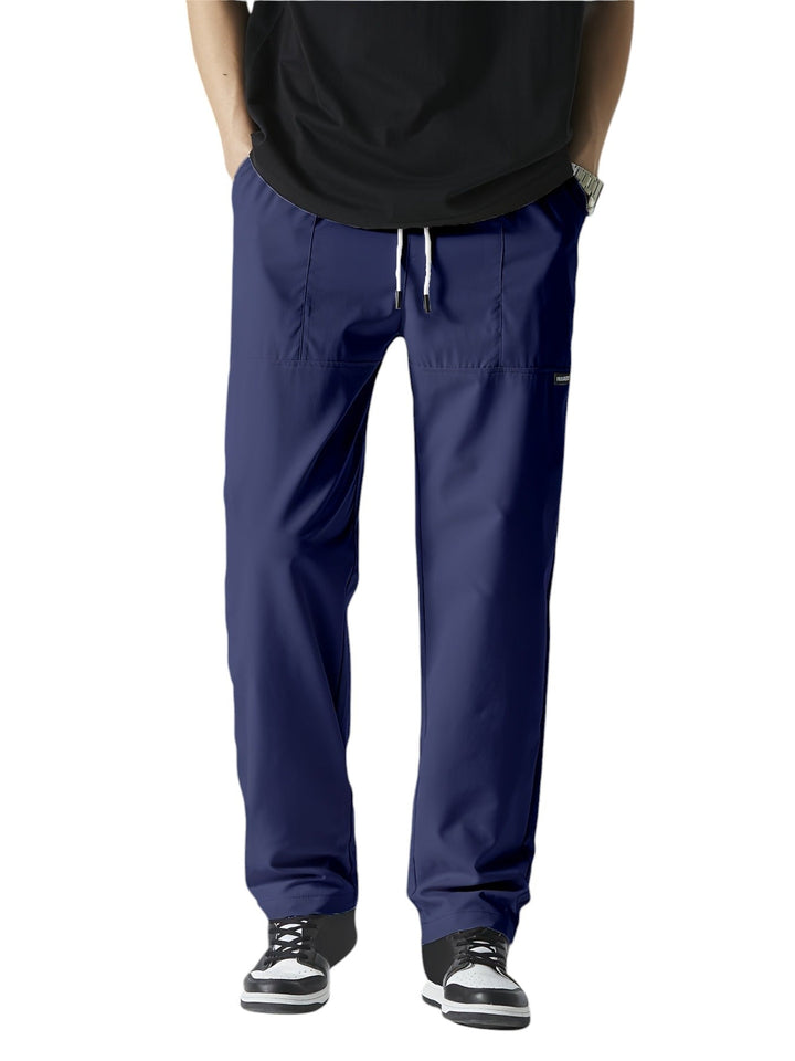 "Casual chique heren joggingbroek, donkergrijs, ademende stof, elastische tailleband met trekkoord, comfortabele pasvorm."
