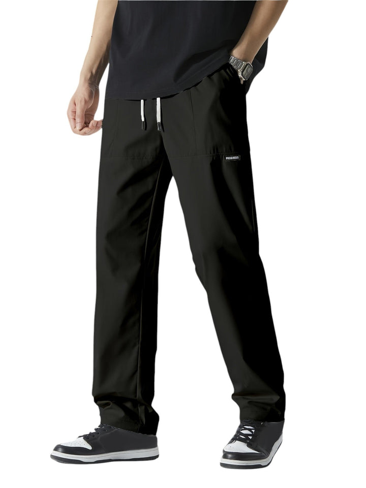 "Casual chique heren joggingbroek, donkergrijs, ademende stof, elastische tailleband met trekkoord, comfortabele pasvorm."