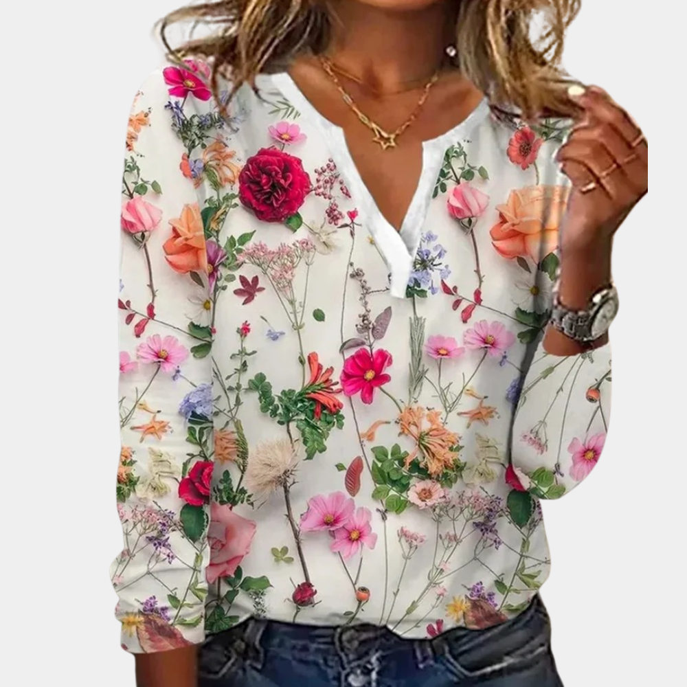 "Casual gebloemde damesblouse met levendig bloemmotief, luchtig ontwerp, ideaal voor lente en zomer."