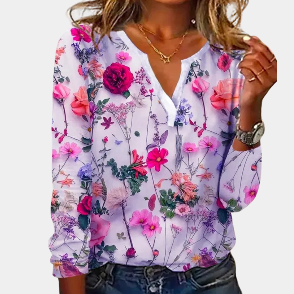 "Casual gebloemde damesblouse met levendig bloemmotief, luchtig ontwerp, ideaal voor lente en zomer."