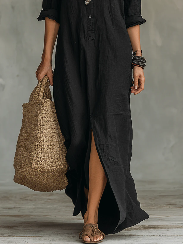 Chique casual dames maxi jurk met overhemdkraag, lange mouwen en verleidelijke zijsplit.