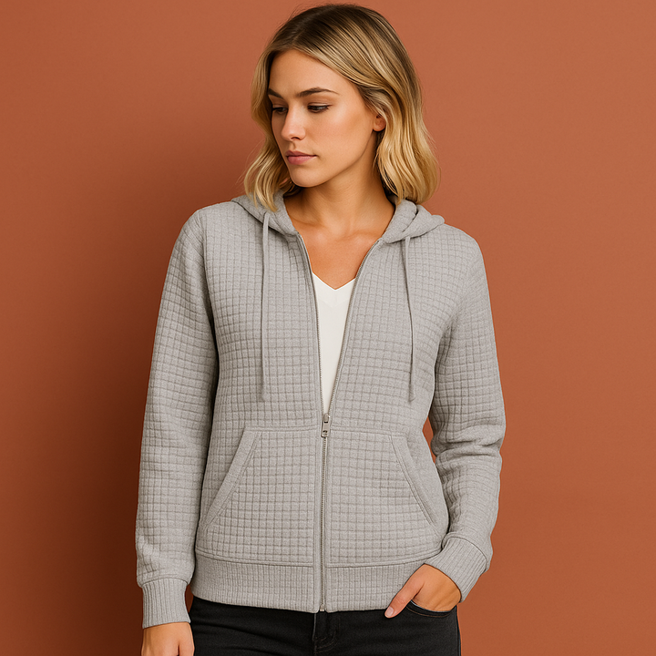 Dames vest met rits en capuchon van zachte stof, ideaal voor dagelijks comfort in de winter.