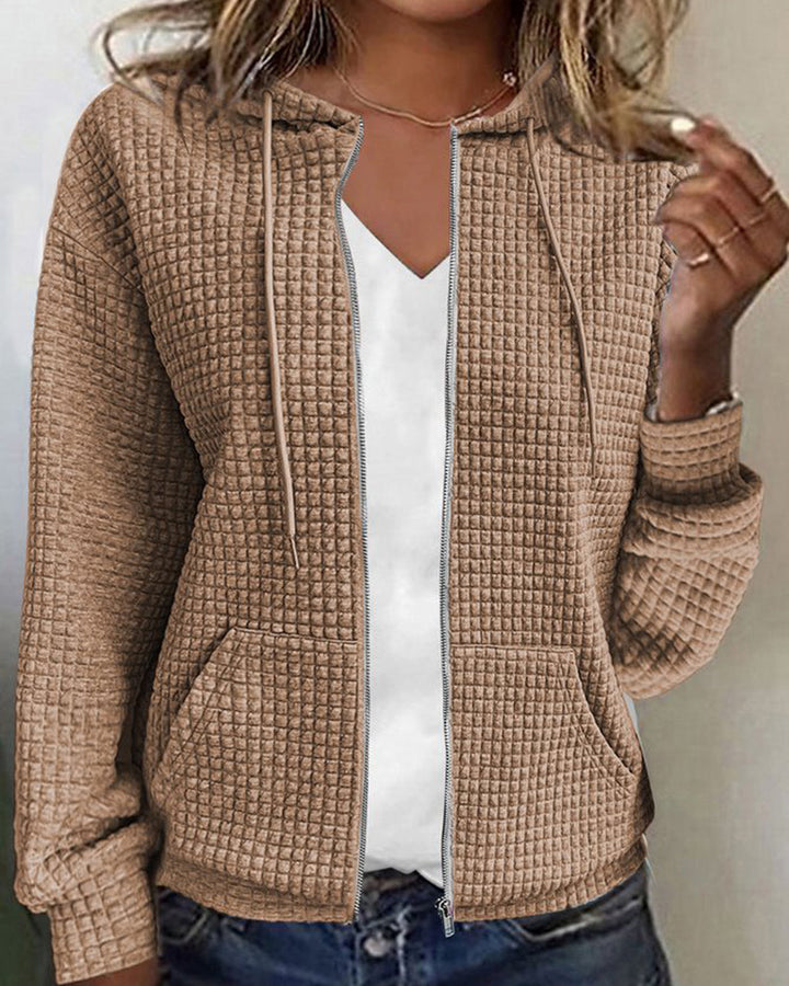 Comfortabel damesvest met capuchon en praktische zakken, perfect voor een casual look.