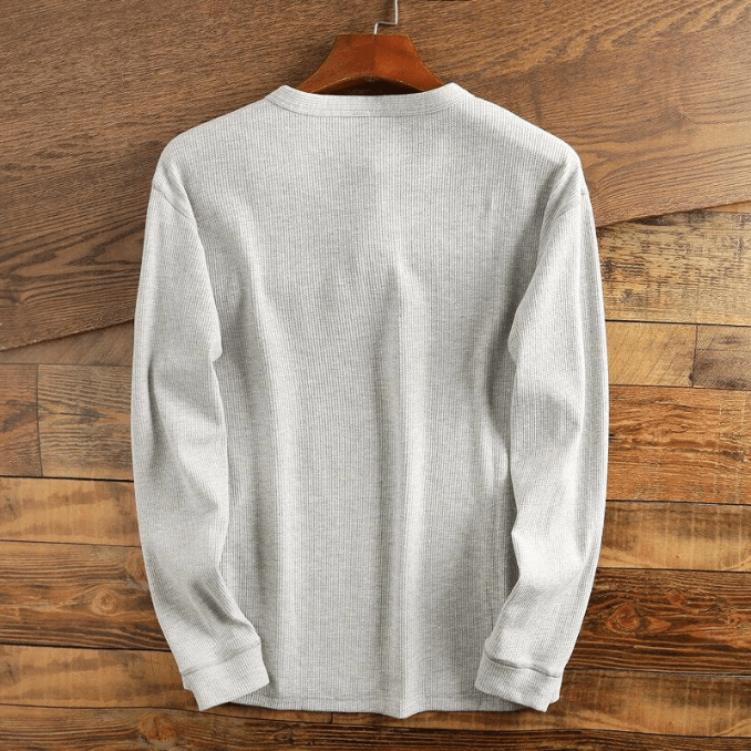 "Comfortabel Henley shirt met wafelstructuur voor heren. Stijlvol, ademend en perfect voor elke gelegenheid."
