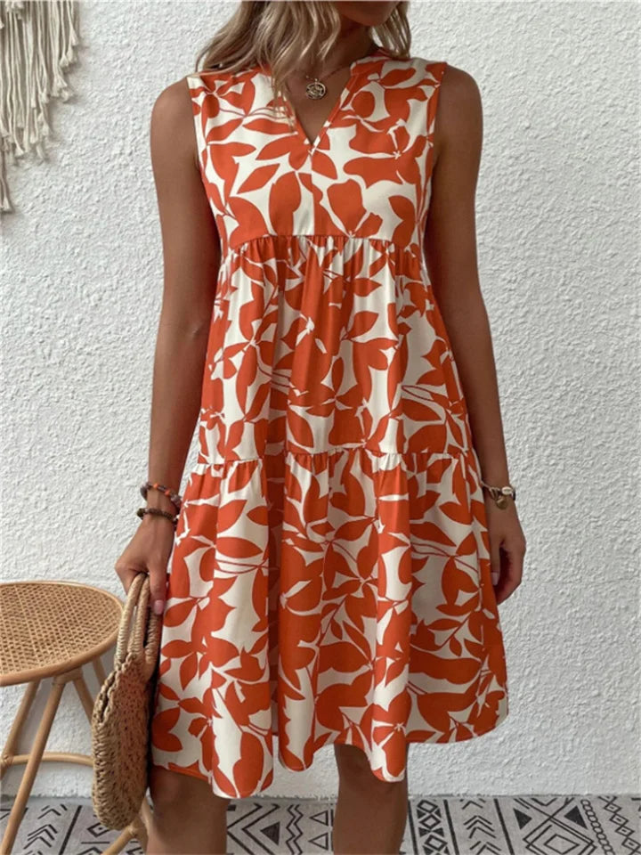 Luchtige bloemen midi zomerjurk voor vrouwen, ideaal voor warme lentedagen en zomeravonden.