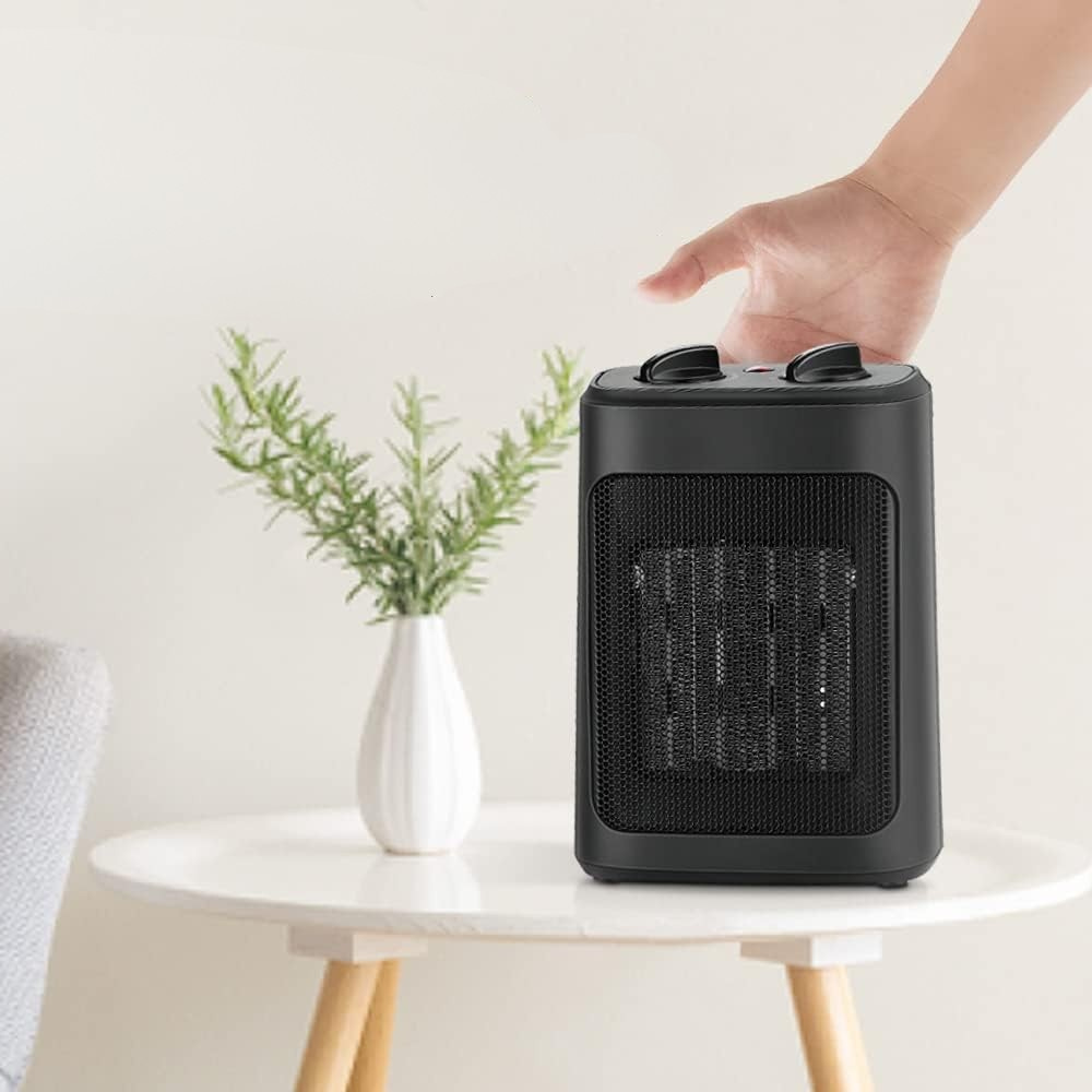Veilige keramische elektrische kachel met draaghandvat voor efficiënte en snelle verwarming in elke ruimte.