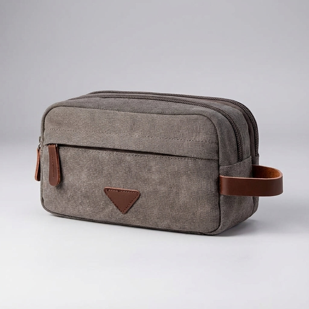 Compacte canvas toilettas, geschikt voor reizen of dagelijks gebruik, met slim dubbel compartiment ontwerp.