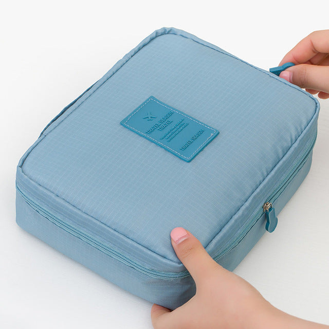 Compacte waterdichte make-up tas en bijpassende mini cosmetica opberger voor dames.