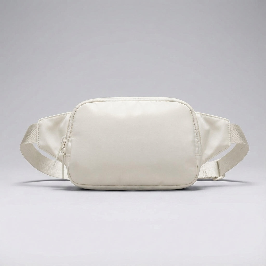 Gedetailleerde compacte heuptas van nylon met ritsvakken en verstelbare band, perfecte reisaccessoire.