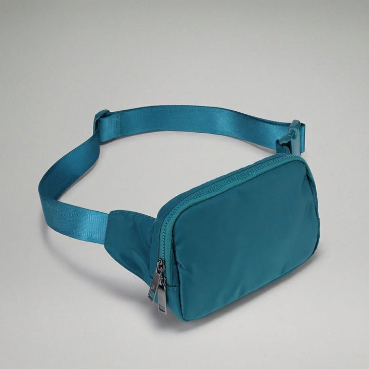 Georganiseerde nylon heuptas Pocklet met meerdere compartimenten voor al je dagelijkse benodigdheden.
