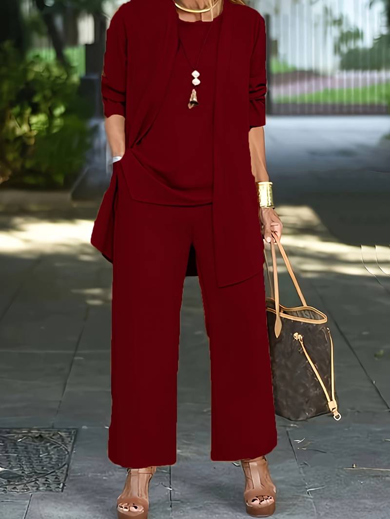 Trendy dames set: lange cardigan, mouwloze top en pantalon. Perfect voor zakelijk casual of ontspannen dagen.