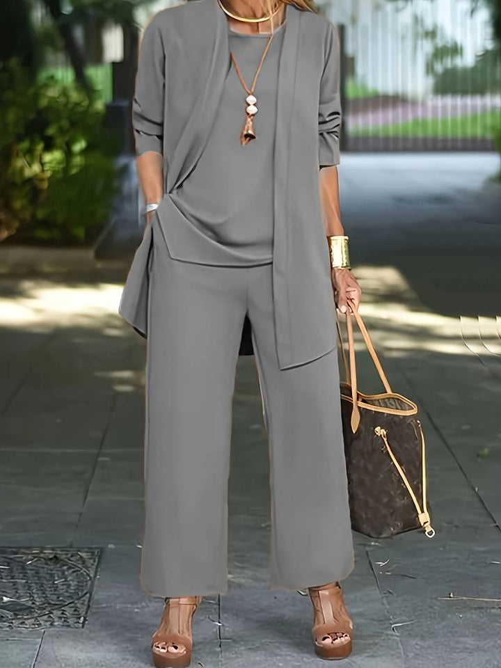 Veelzijdige dames set met soepele cardigan, basic top en rechte broek. Geschikt voor werk en vrije tijd.