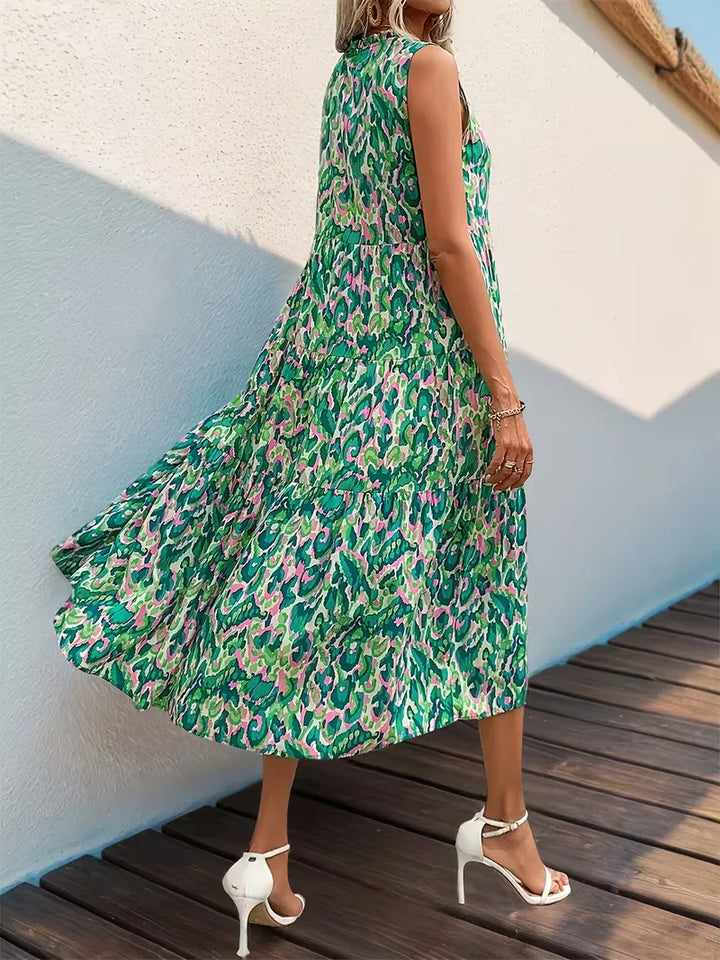 Mouwloze midi A-lijn jurk voor dames, met V-hals en kleurrijke kwastjes; ideaal voor strand.