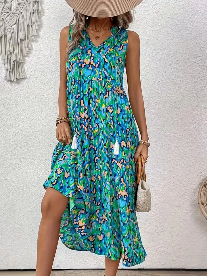 A-lijn jurk voor dames, met V-hals en charmante kwastjes; een trendy bohemian zomeroutfit.
