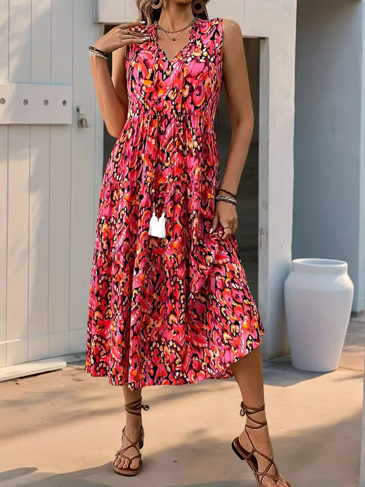 Casual A-lijn damesjurk met V-hals en kwastjes; perfect voor een ontspannen zomerse look.