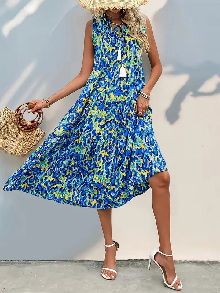 Dames zomerjurk A-lijn, V-hals en speelse kwastjes; perfect voor een casual, luchtige stijl.