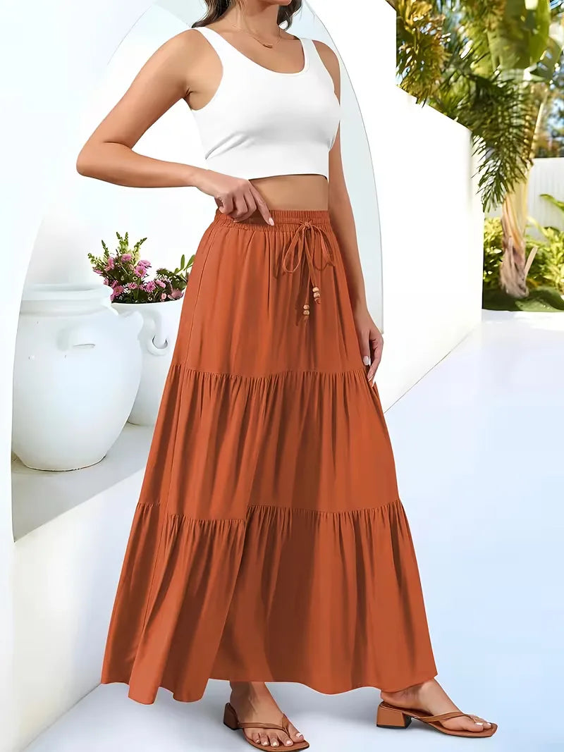 Vloeiende A-lijn maxi rok voor dames met hoge taille, geeft een ontspannen zomerse vibe.