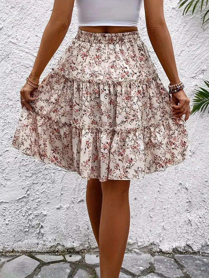 Modieuze A-lijn damesrok met vrolijke bloemenprint, comfortabel en knielengte, perfect voor lente/zomer.