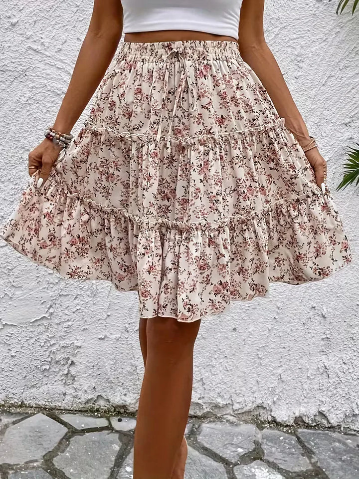 Comfortabele roze A-lijn rok voor dames met frisse bloemenprint, perfect voor een modieuze en luchtige zomeroutfit.