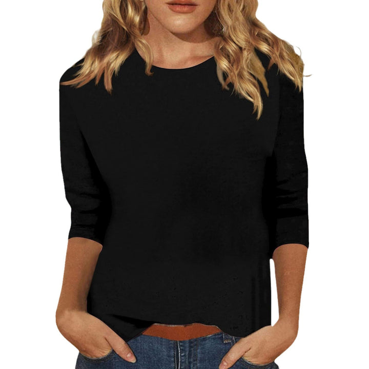 Zwarte basic damestop met 3/4 mouwen, modieus en comfortabel voor dagelijks gebruik.