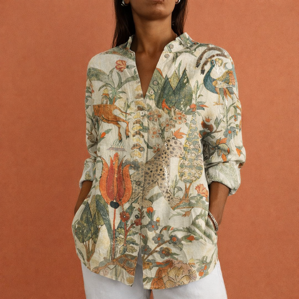 Bedrukte damesblouse met modern abstract patroon, klassieke kraag en lange mouwen. Veelzijdig en comfortabel.