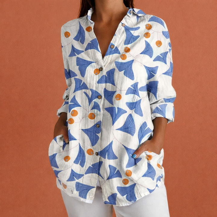 Moderne damesblouse met bloemenprint, lange mouwen en klassieke kraag. Combineert elegantie met comfort.