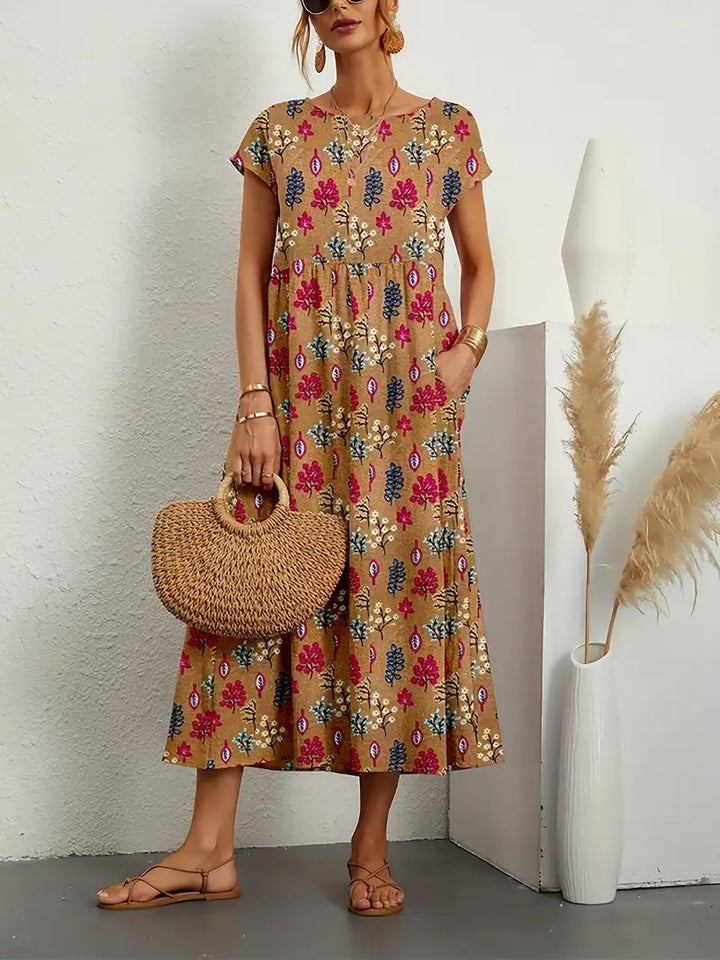 Luchtige dames zomerjurk met vrolijke bloemenprint, A-lijn model en zakken voor een comfortabele look.