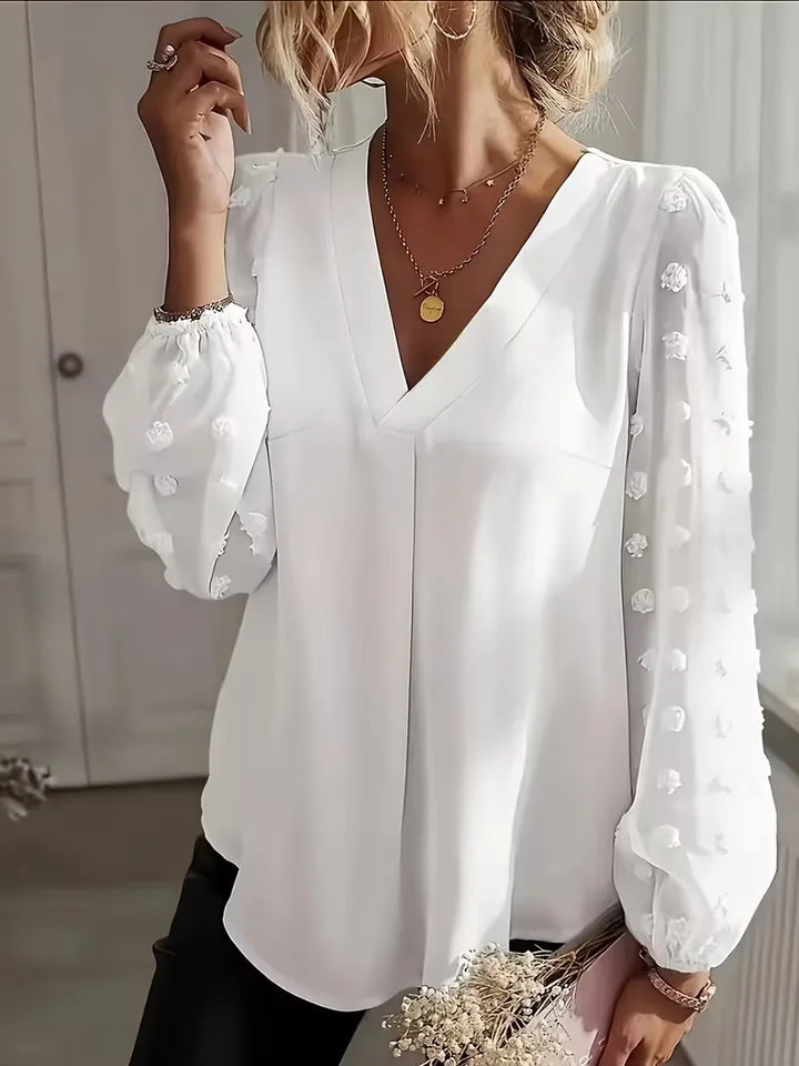 Veelzijdige damesblouse met doorschijnende lange mouwen, V-hals, geschikt voor elke outfit.