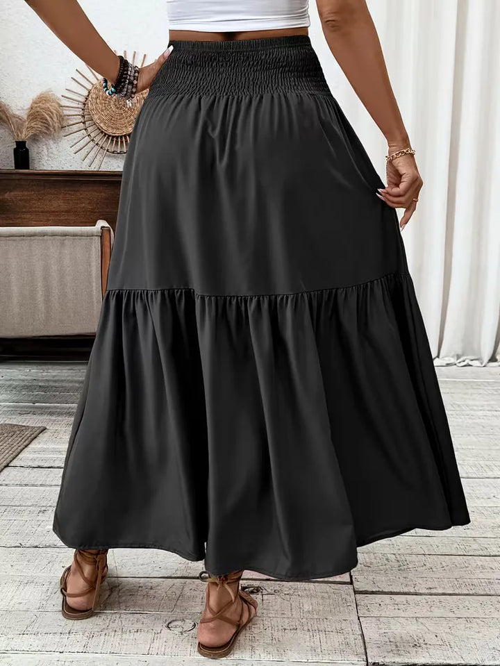 Elegante bohemian A-lijn maxi rok voor dames, met comfortabele smock taille en gelaagde stof.