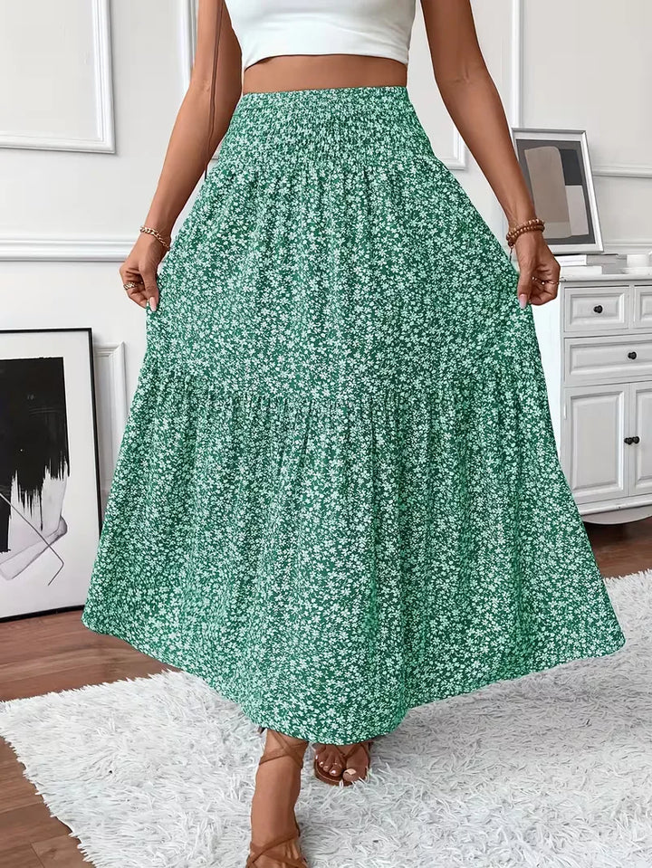 Stijlvolle dames A-lijn maxi rok met bohemian print, gelaagd design en elastische smock taille.