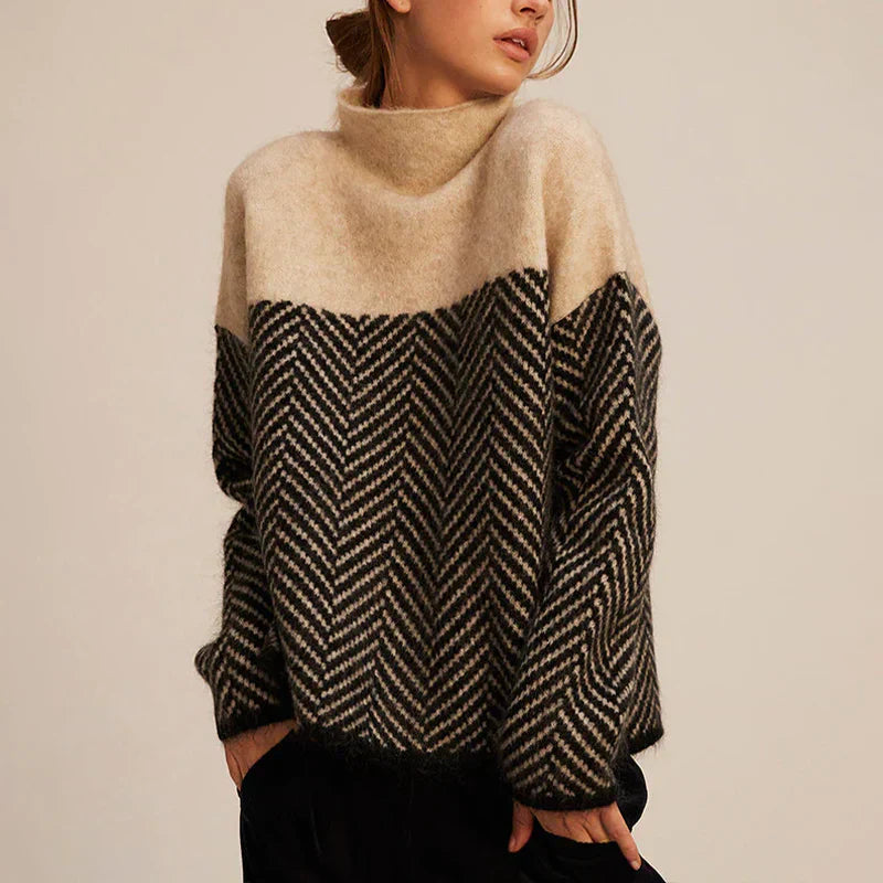 Dames coltrui met elegant visgraatpatroon, perfect voor casual herfst- en wintermode. Relaxte pasvorm.