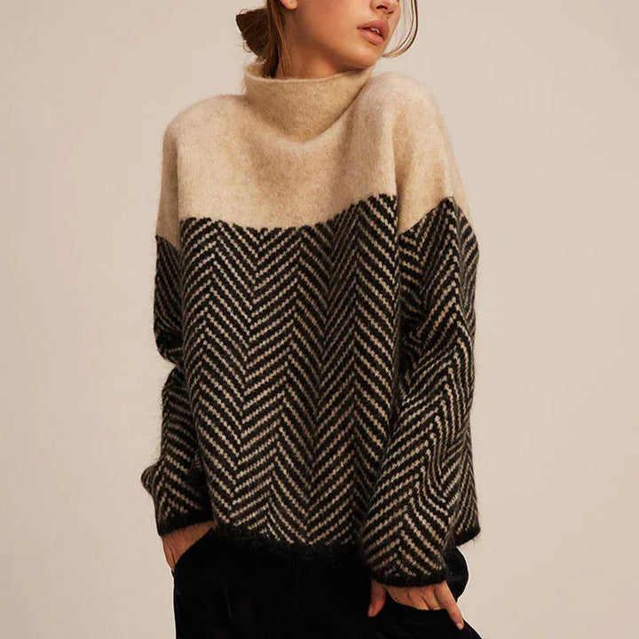 Dames coltrui met elegant visgraatpatroon, perfect voor casual herfst- en wintermode. Relaxte pasvorm.